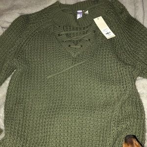 Francesca’s green sweater